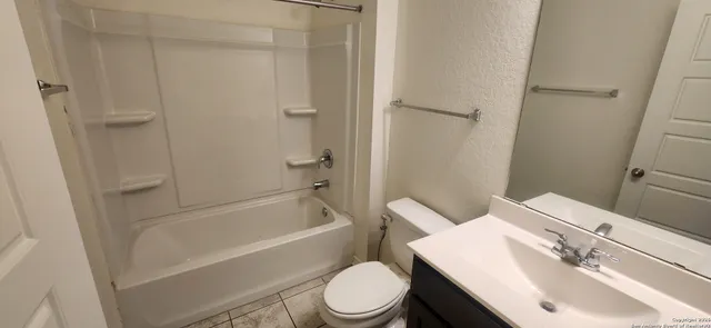 a bathroom with a sink toilet and a bathtub