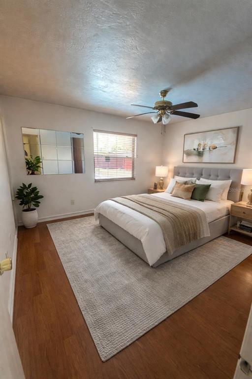 5020 Pine Street Seffner, FL 33584 - Photo 8 of 14 a bedroom with a large bed and a chandelier