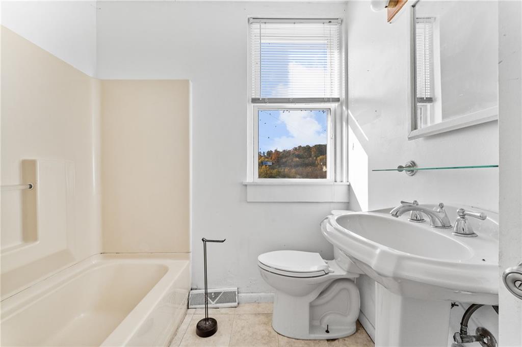 797 Carlton Drive Bentleyville, PA 15314 - Photo 12 of 24 a bathroom with a sink toilet and shower