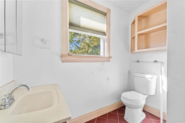 a bathroom with a toilet and a sink