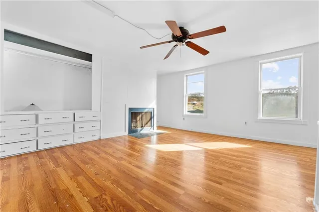 a view of a bedroom with cabinet cabinet and windows