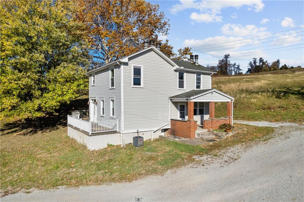 797 Carlton Drive Bentleyville, PA 15314 - Photo 2 of 24 a front view of a house with porch