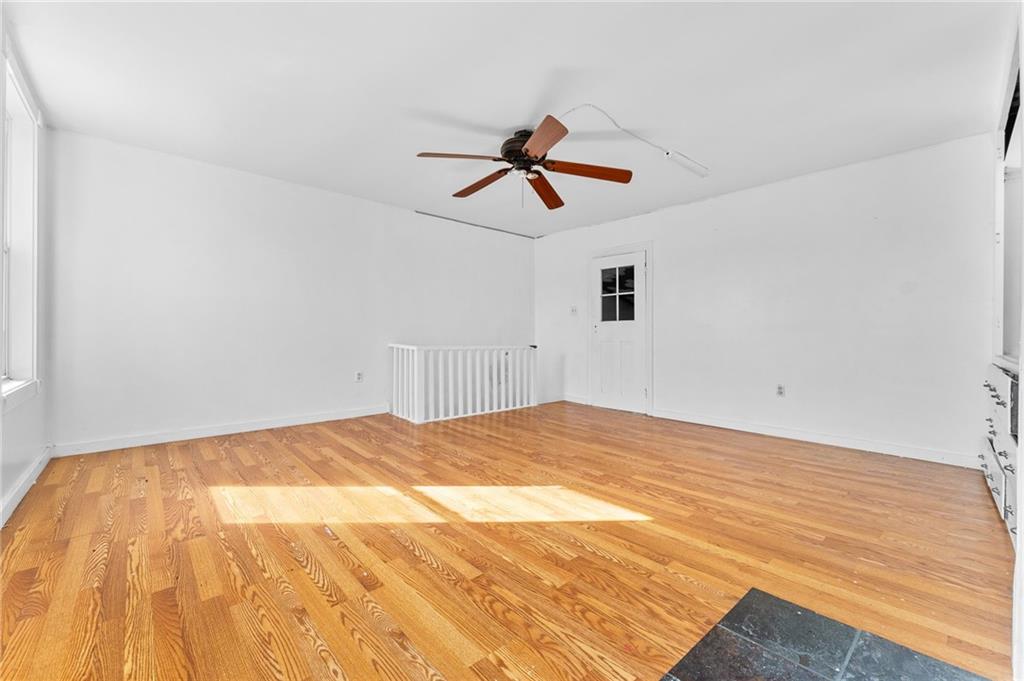 797 Carlton Drive Bentleyville, PA 15314 - Photo 22 of 24 a view of a room with wooden floor and ceiling fan