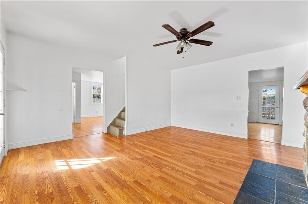 797 Carlton Drive Bentleyville, PA 15314 - Photo 7 of 24 a view of a room with wooden floor and a ceiling fan