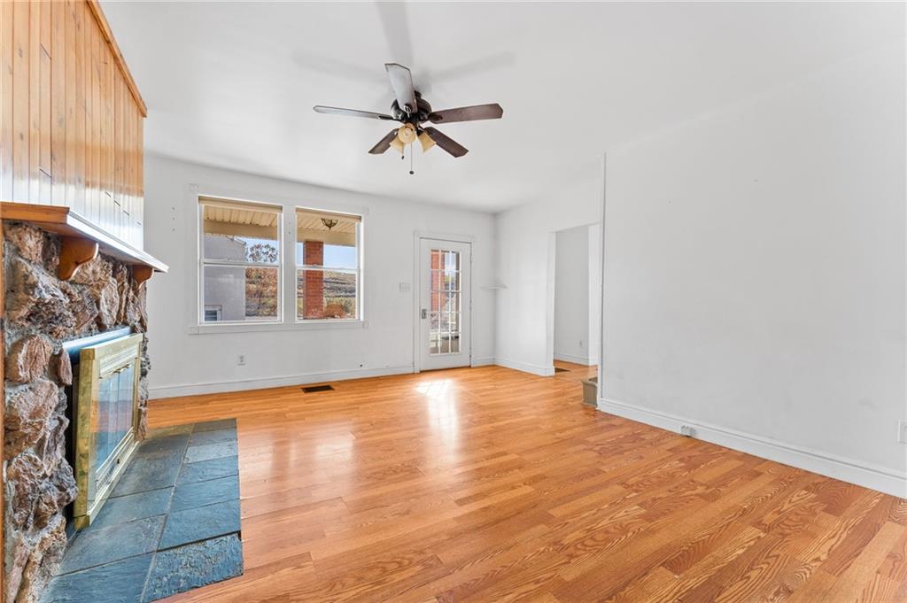 797 Carlton Drive Bentleyville, PA 15314 - Photo 8 of 24 a view of an empty room with window and wooden floor