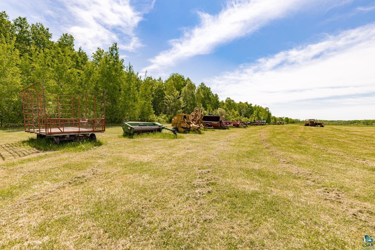 6606 Metso Road Kettle River, MN 55757 - Photo 60 of 84 Expansive grassy field bordered by a dense tree line