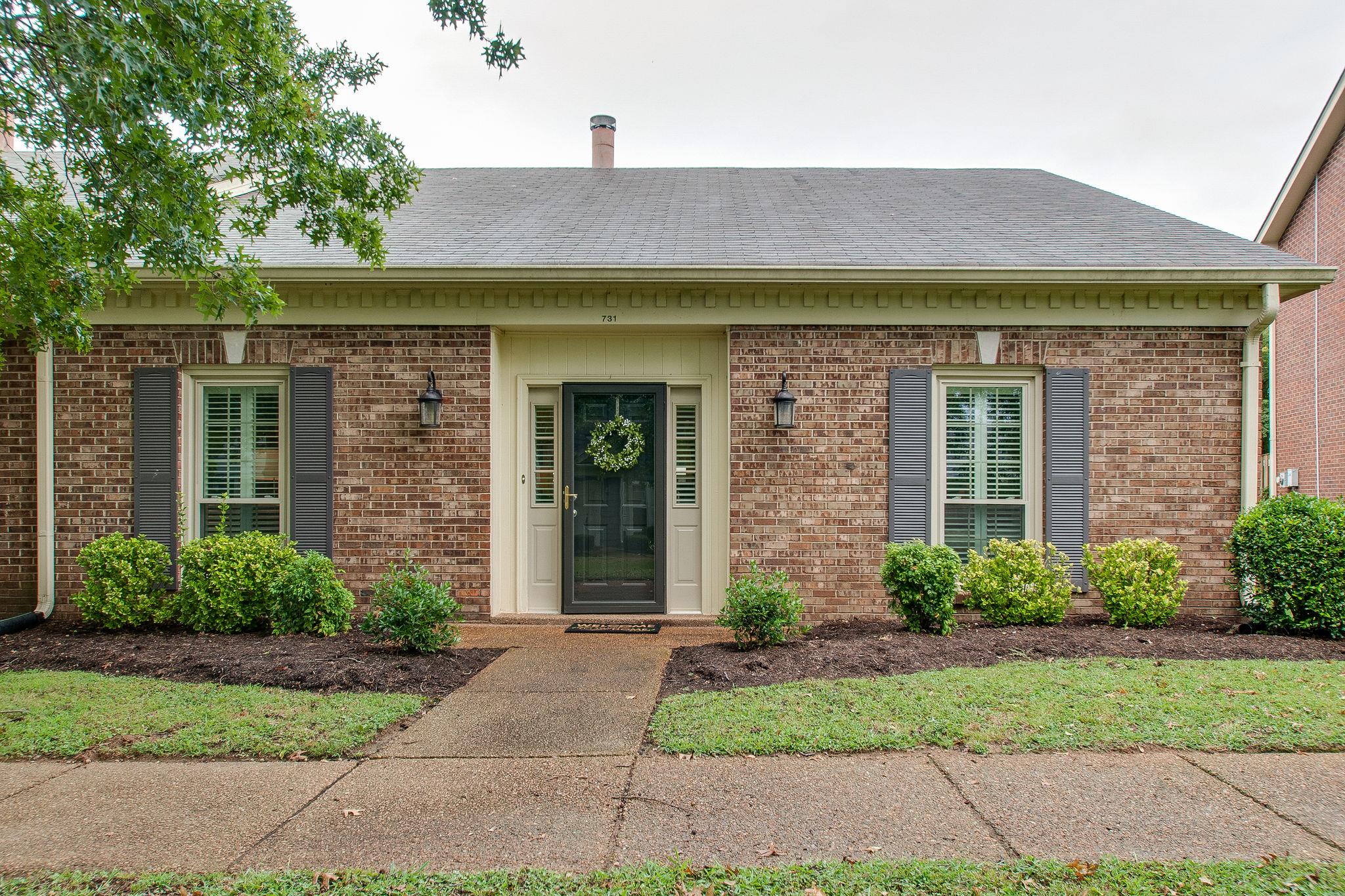 731 General George Patton Road Nashville, TN 37221 - Photo 1 of 19 a front view of a house with garden