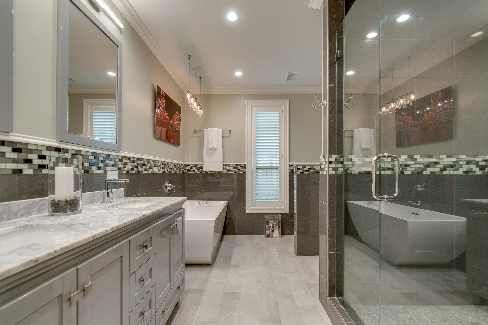 731 General George Patton Road Nashville, TN 37221 - Photo 16 of 19 a bathroom with a tub a double vanity sink and mirror