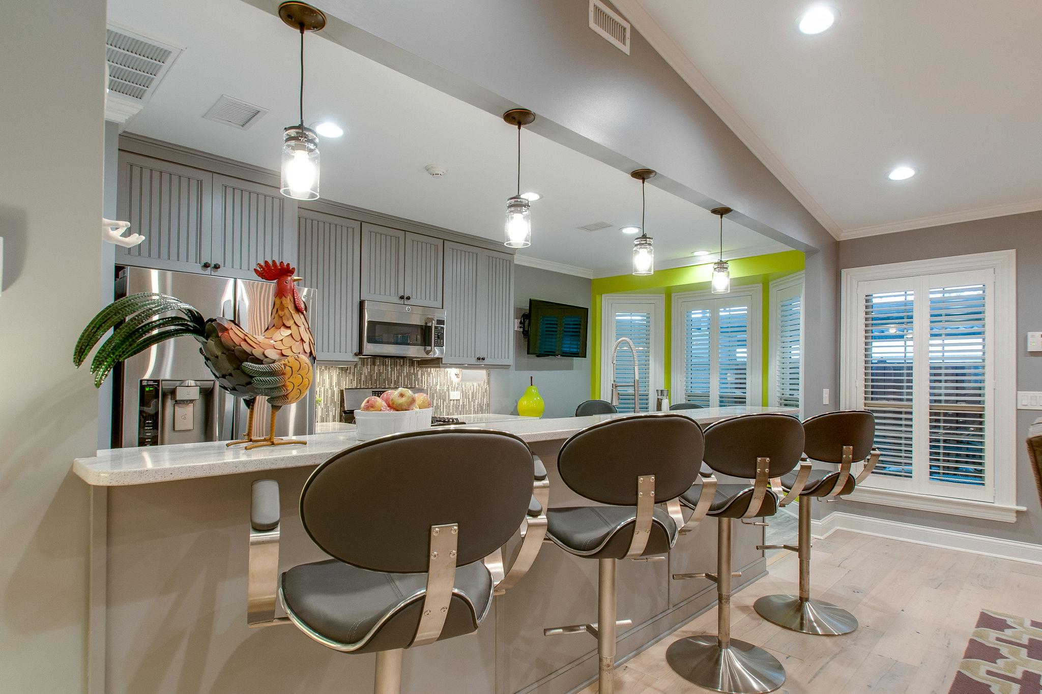 731 General George Patton Road Nashville, TN 37221 - Photo 6 of 19 a living room with furniture a flat screen tv and kitchen view