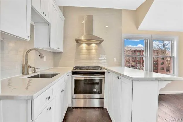 a kitchen with a stove and a sink
