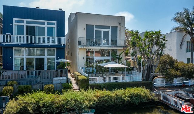 a house with lots of garden in front of it