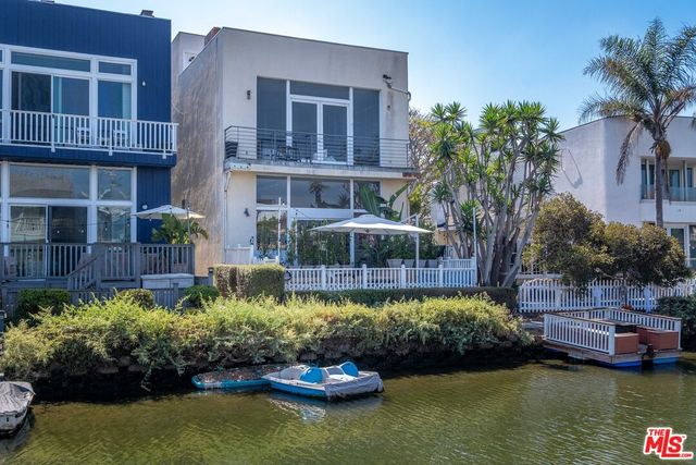 a view of a house with a yard garden and swimming pool