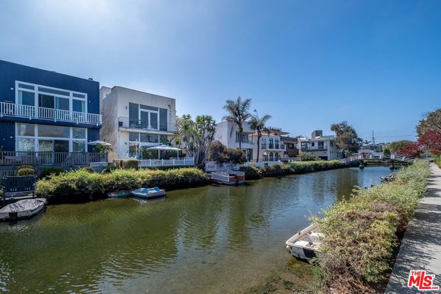 a view of a lake with building and outdoor space