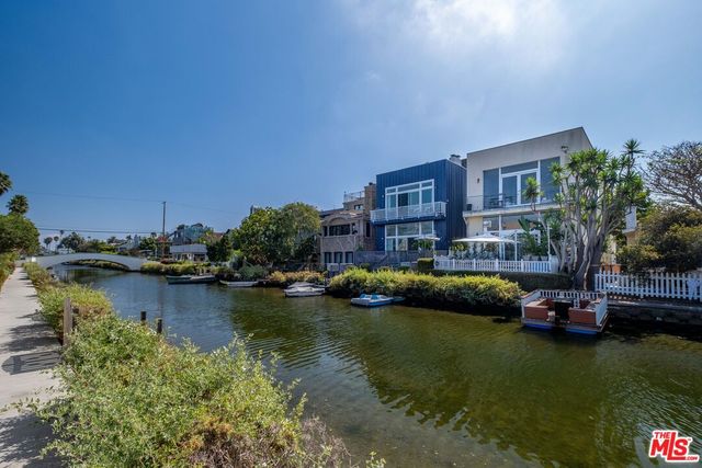 a view of a lake with building in front of it