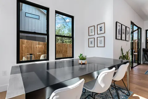 a view of a dining room with furniture window and wooden floor