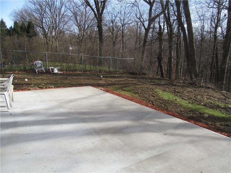 1119 Harvard Road Monroeville, PA 15146 - Photo 22 of 22 Brand new concrete patio and new lateral sewer line. (under the disturbed yard)