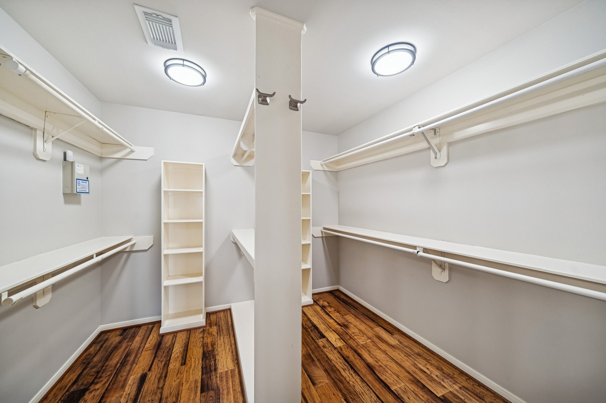 2114 Lytham Lane Katy, TX 77450 - Photo 15 of 29 This spacious primary walk-in closet features ample shelving and hanging space, offering plenty of storage and organization options.