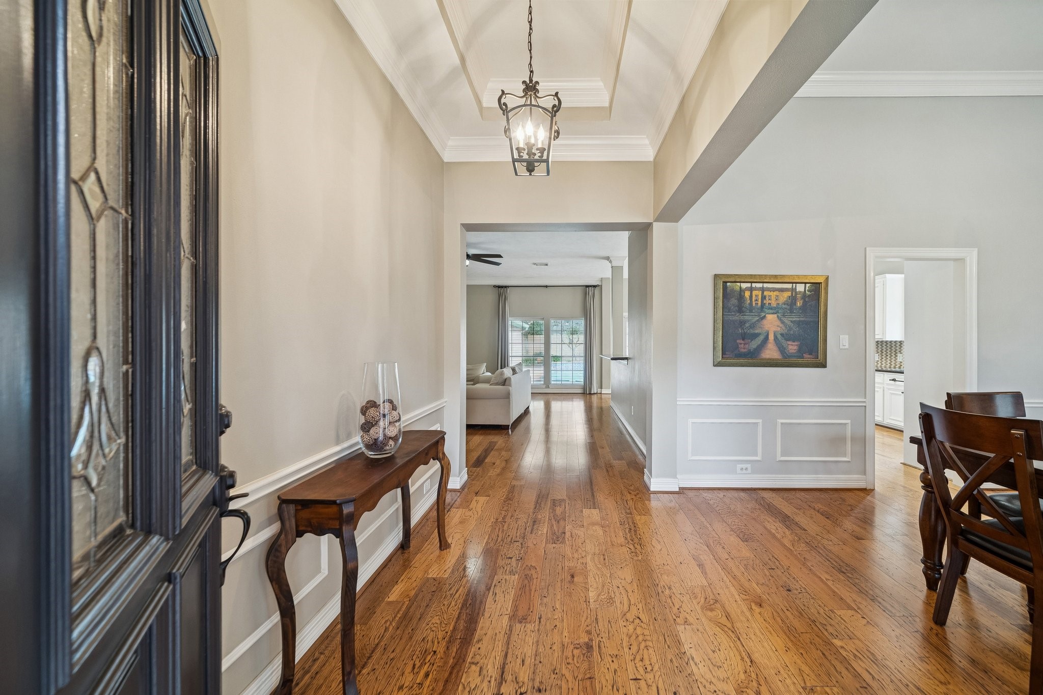 2114 Lytham Lane Katy, TX 77450 - Photo 2 of 29 Entryway with beautiful engineered hardwood floors and elegant molding. To the right reveals a glimpse of the formal dining room.