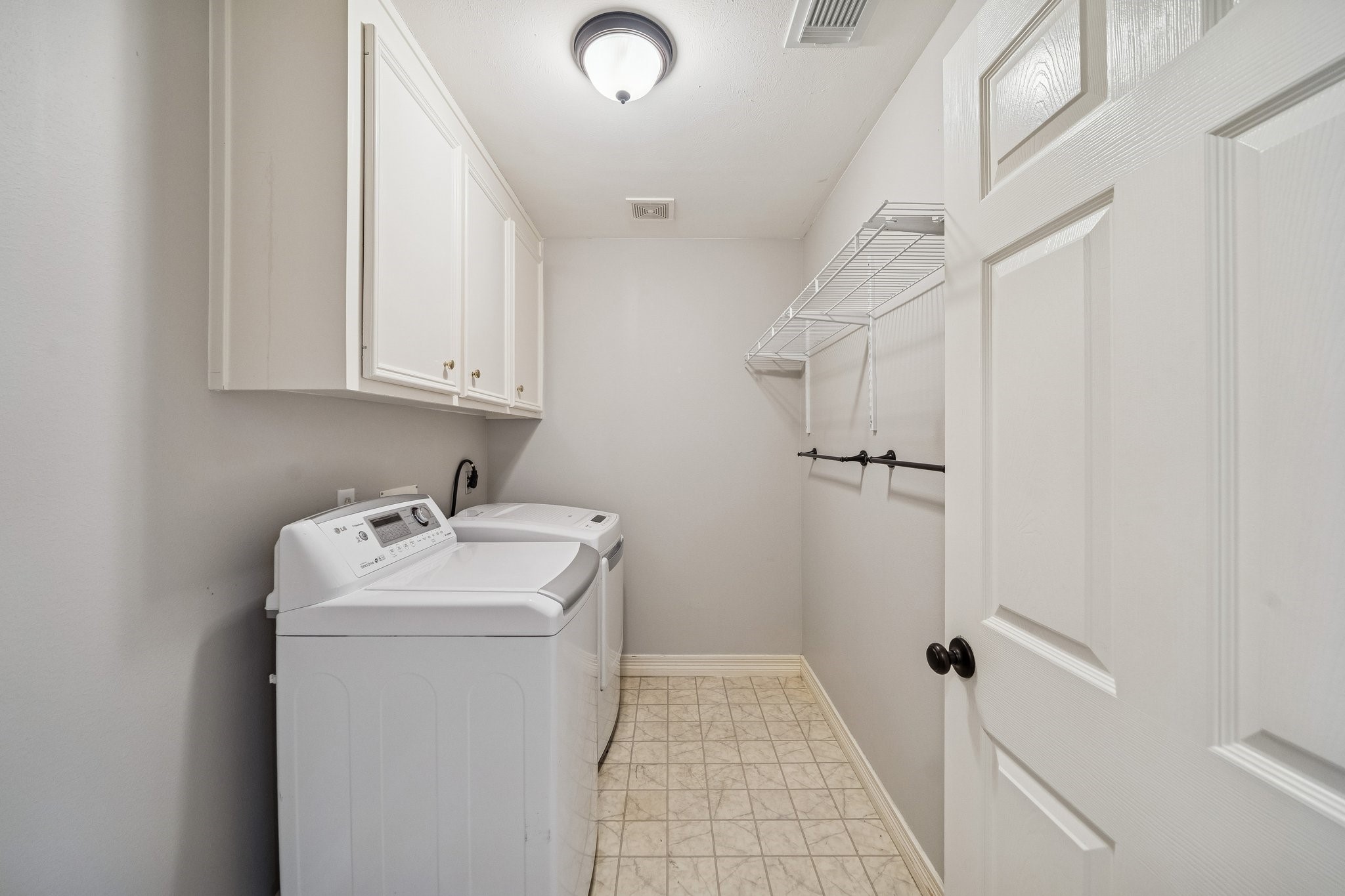 2114 Lytham Lane Katy, TX 77450 - Photo 21 of 29 Laundry room with washer and dryer.