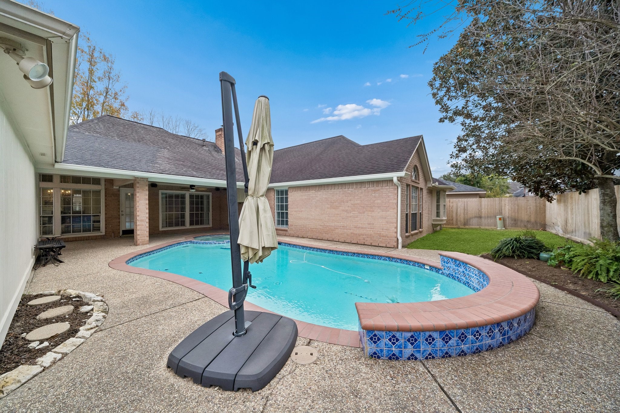 2114 Lytham Lane Katy, TX 77450 - Photo 23 of 29 Pool with an attached hot tub, creating the perfect space to relax, unwind, and entertain—ideal for enjoying sunny days and soothing evenings at home.