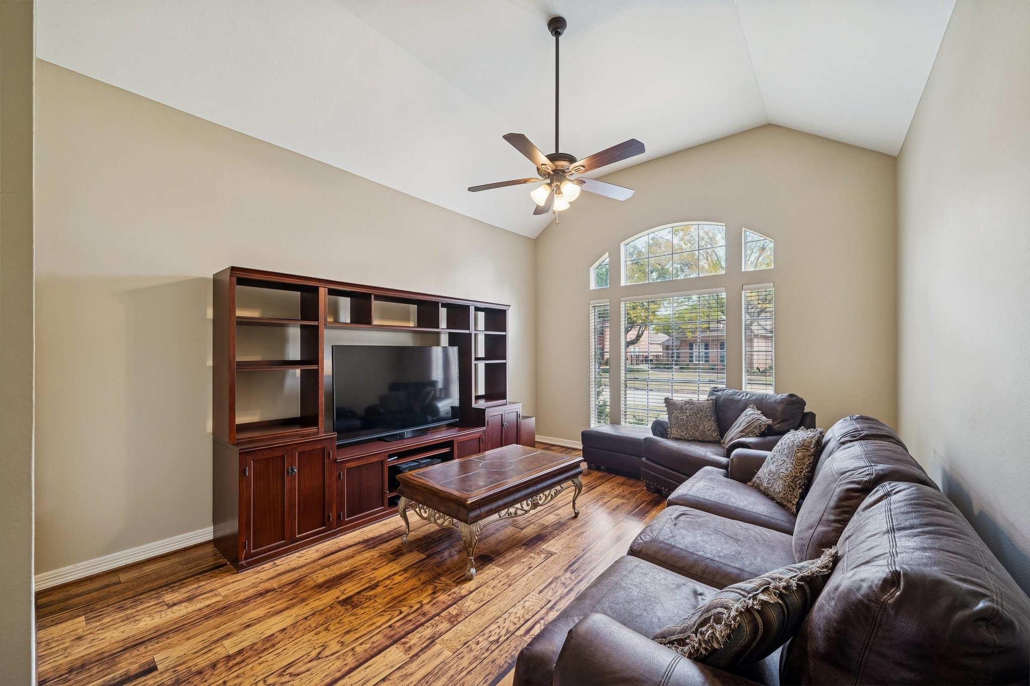 2114 Lytham Lane Katy, TX 77450 - Photo 9 of 29 Large game room with high ceilings. This space is perfect for entertainment, boasting ample room for games, activities, and gatherings.