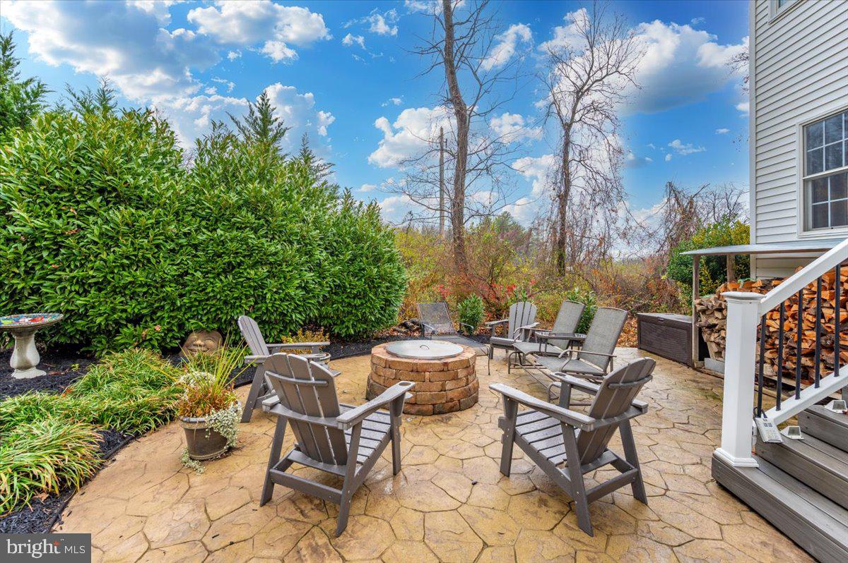6536 South Clifton Road Frederick, MD 21703 - Photo 50 of 71 a view of a patio with a table and chairs and potted plants