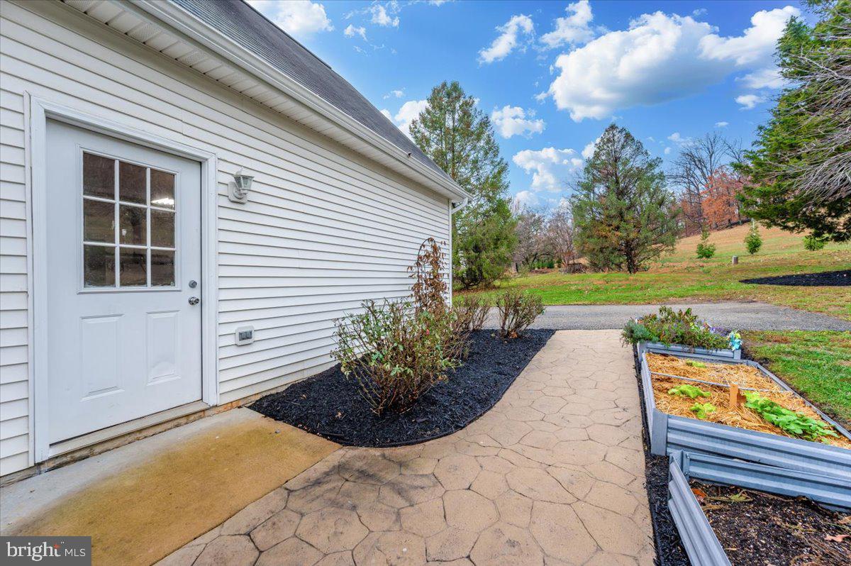 6536 South Clifton Road Frederick, MD 21703 - Photo 54 of 71 a view of a backyard with garden