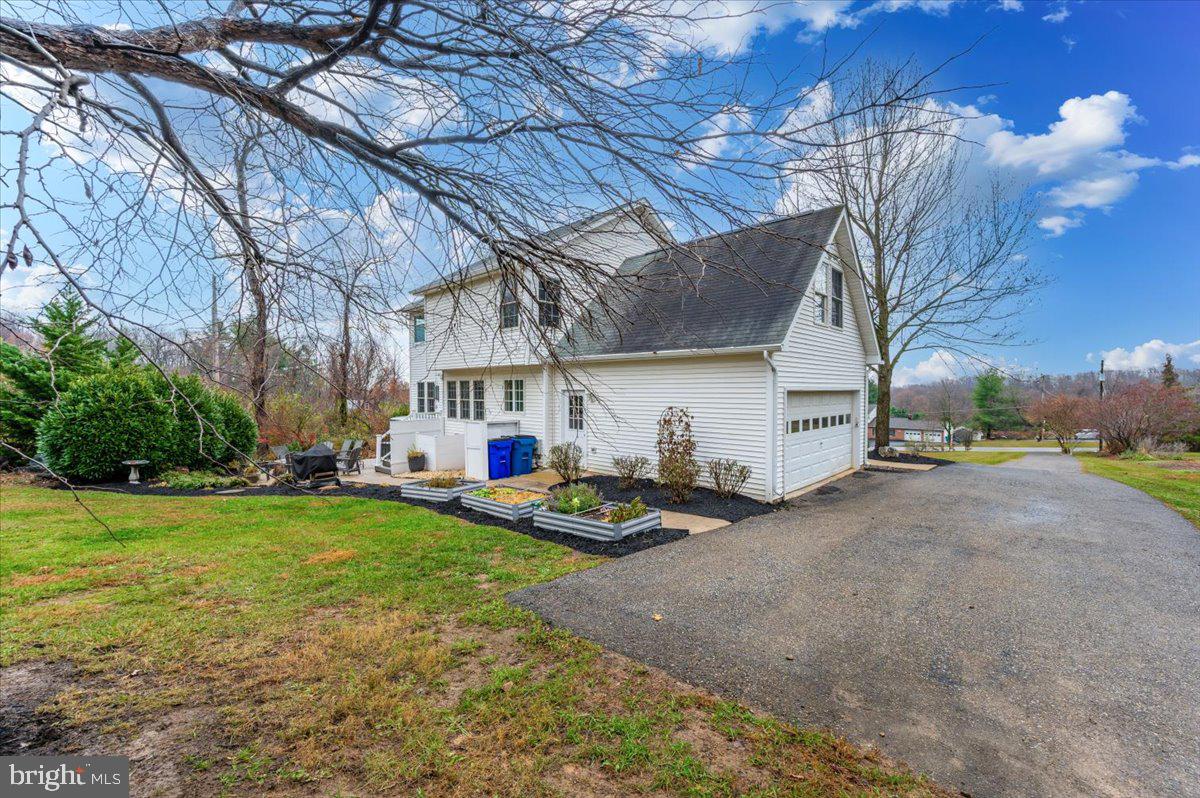 6536 South Clifton Road Frederick, MD 21703 - Photo 60 of 71 a view of a house with a yard and garage