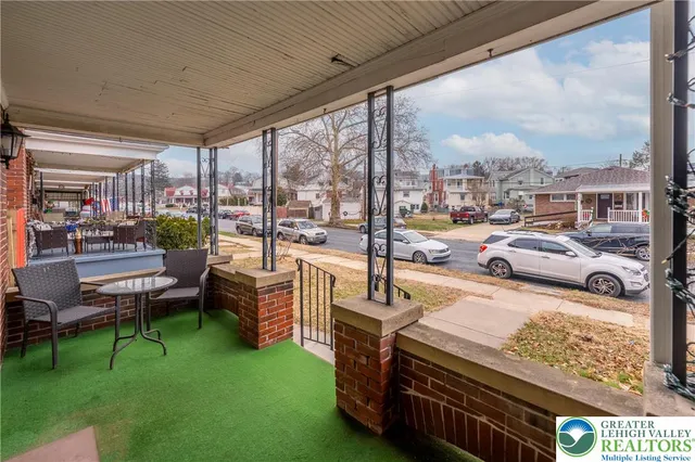 a building outdoor space with patio furniture and a patio