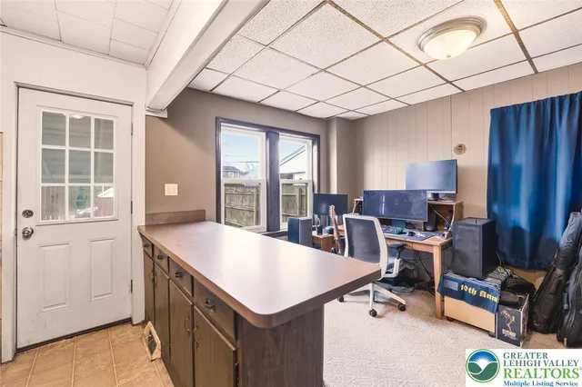 a view of kitchen with sink refrigerator and dining table