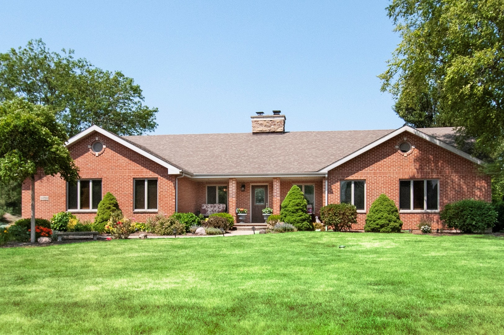 24738 South Walnut Street Elwood, IL 60421 - Photo 1 of 20 a front view of house with yard and green space