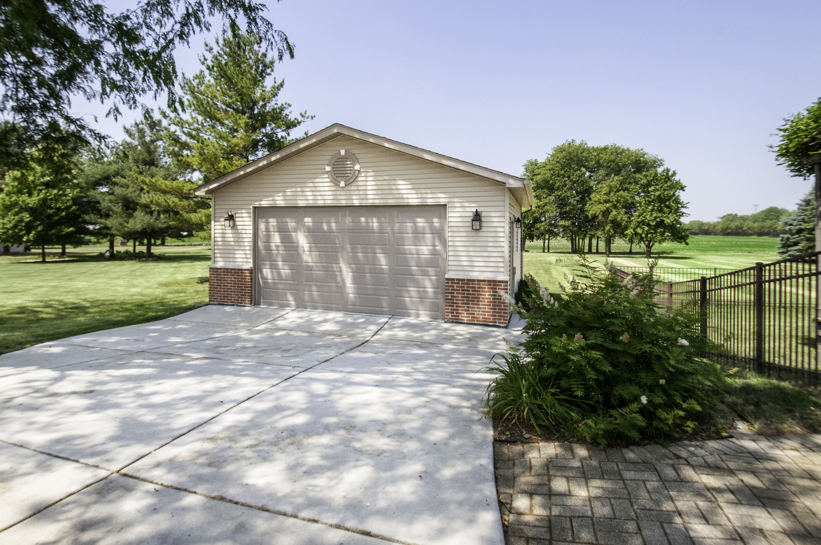 24738 South Walnut Street Elwood, IL 60421 - Photo 3 of 20 a front view of a house with a yard and lake view in back