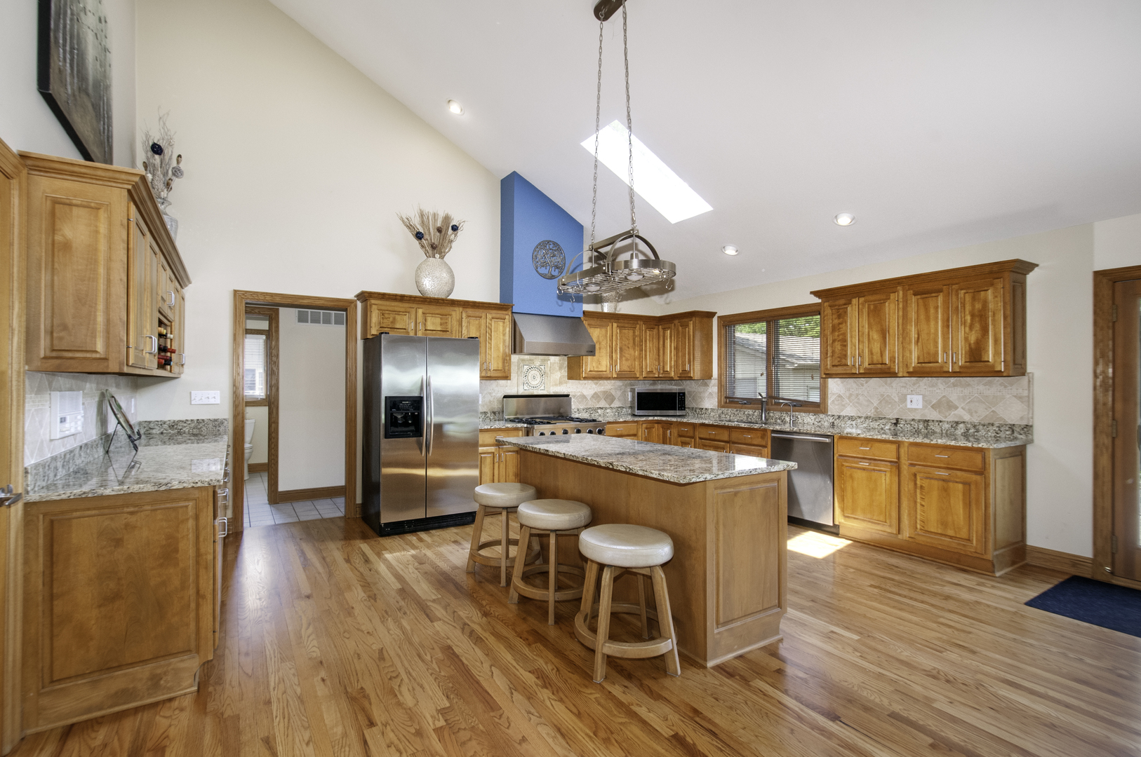 24738 South Walnut Street Elwood, IL 60421 - Photo 10 of 20 a large kitchen with a table and chairs in it