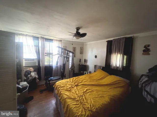 a bed sitting in a room next to a window
