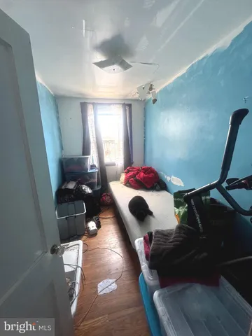 a bed room with a bed and a chair