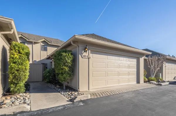 a front view of a house with a garage