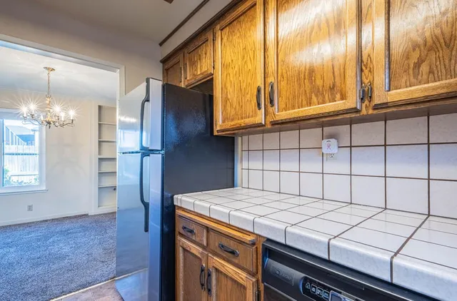 an empty room with sliding glass door and shower