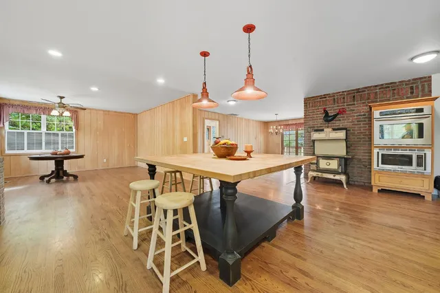 a living room with furniture and flowers