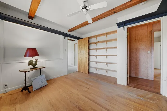 a view of a house with a yard and tree s