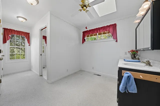 a view of a house with backyard sitting area and garden