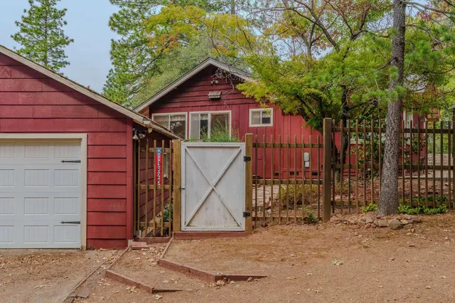 an aerial view of a house with outdoor space and a outdoor space