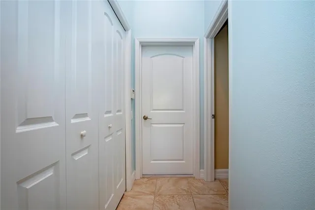 a living room with furniture a rug and a flat screen tv