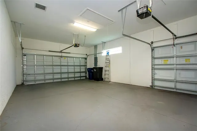 a view of a dining room with furniture and a potted plant