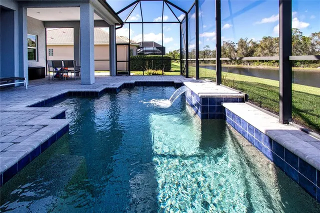 a view of a tennis ground and a yard