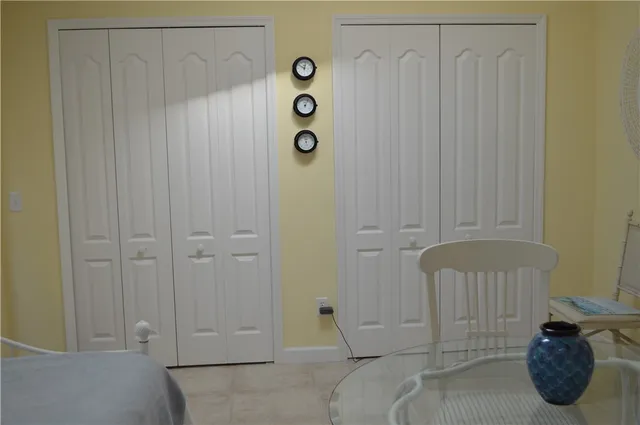 a bedroom with a bed and a table in it