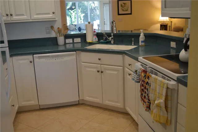 a kitchen with a sink and cabinets