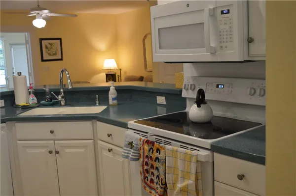a kitchen with a sink and cabinets