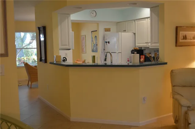 a view of a living room with bathroom