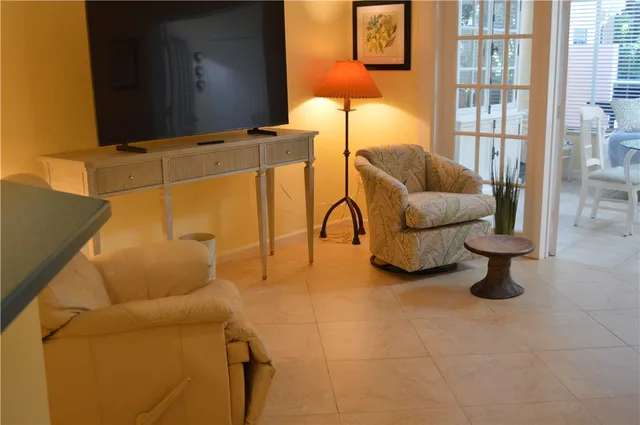 a living room with furniture and a rug