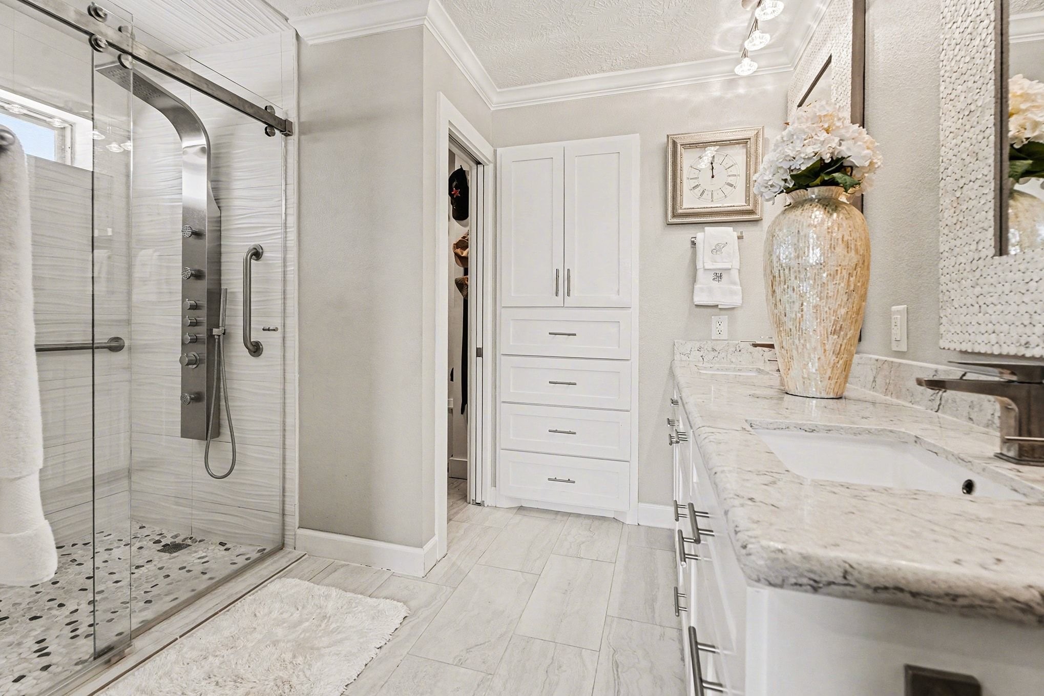a bathroom with a shower and a sink